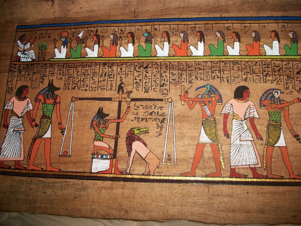 Pictures of Anubis the Egyptian god judging a dead