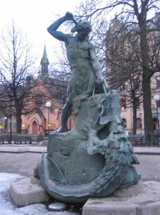 A statue of the viking god thor slaying the serpent